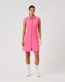 Woman wearing a pink sleeveless dress on a white background