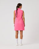 Person wearing a pink dress on a white background