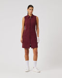 Woman wearing a burgundy sleeveless dress on a white background