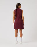 Woman wearing a maroon dress on a white background