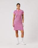 Woman wearing a pink checkered dress on a white background