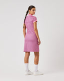 Woman wearing a pink dress on a white background