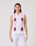 Woman wearing a pink and white argyle patterned sleeveless top with a plain background