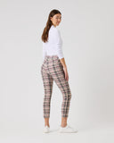 Person wearing plaid pants and a white shirt on a plain background