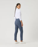 Person wearing a white shirt and blue checkered pants on a white background