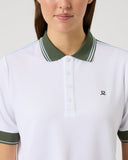 White polo shirt with green accents worn by a person on a light gray background