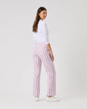 Person wearing a white top and pink checkered pants on a white background