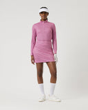 Person wearing a pink checkered dress on a white background