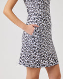 Leopard print dress worn by a person on a plain background