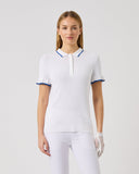 Woman wearing a white polo shirt with blue accents on a light gray background