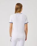 Person wearing a white outfit with blue accents on a light gray background