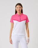 Woman wearing a pink and white outfit on a gray background