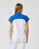 Woman wearing a blue and white shirt on a light gray background