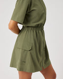 Green dress with a pocket on a plain background