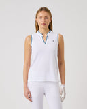 Woman wearing a white sleeveless top with a blue trim on a light gray background