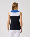 Woman wearing a sleeveless top with blue and black design on a white background