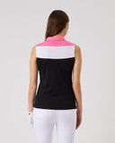 Woman wearing a sleeveless black and white top with pink collar on a gray background