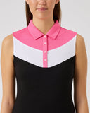 Woman wearing a sleeveless dress with a pink and white collar on a gray background