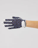 Navy patterned glove on a light gray background