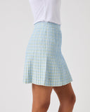 Light blue checkered skirt worn by a person on a white background