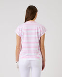 Woman wearing a pink striped shirt and white pants on a light gray background