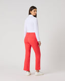Daily Sports Flare Poppy Red Ankle Pants in bold poppy red – women's slim-fit flare leg golf pants showing clean back panel and ankle-length flared hem, back view