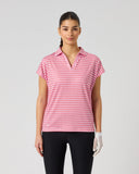 Daily Sports Sunny Geo Printed Air Cap Sleeve Polo in hot pink and white geometric grid print – women's cap sleeve golf polo with open V-neck collar and relaxed boxy fit, front view on model styled with black trousers and golf glove