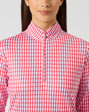 Daily Sports Sunny Geo Printed Air Long Sleeve Top close-up of pink and white geo check print with quarter-zip collar and logo zipper pull detail