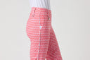 Daily Sports Magic Sunny Geo Print Straight Ankle Pants close-up of pink and red geo print fabric with white contrast side seam stripe, silver logo button and zip pocket detail