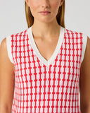 Daily Sports Sunny Geo Jacquard V-Neck Vest close-up of pink-red and white geometric jacquard knit pattern with V-neck and white contrast trim detail