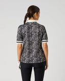 Daily Sports Zebra Print Half Sleeve Polo Shirt in black and white abstract zebra swirl print – women's half sleeve golf polo showing all-over print back panel, cream collar and striped cuff trim, back view on model