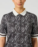Daily Sports Zebra Print Half Sleeve Polo Shirt close-up of black and white abstract zebra swirl print with cream contrast polo collar, silver button placket and black and white striped sleeve cuff detail