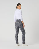 Daily Sports Printed Zebra Black Magic Pants in black and white abstract swirl print – women's slim-fit golf pants, back view showing rear pockets