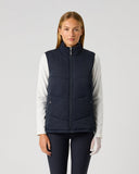 Women's reversible solid dark navy padded golf vest with full front zip, zipped pockets, and stand-up collar – solid side front view
