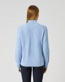 Women's light blue structured ribbed knit golf pullover with relaxed fit and geometric rib pattern – back view
