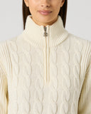 Daily Sports Ivory Cable Pullover Lined close-up of cream ivory cable-knit pattern with quarter-zip stand collar and silver logo zipper pull detai