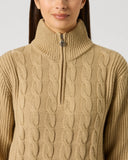 Daily Sports Bark Cable Pullover Unlined close-up of warm camel cable-knit pattern with quarter-zip stand collar and silver logo zipper pull detai