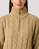 Daily Sports Bark Cable Pullover Lined close-up of warm camel cable-knit pattern with quarter-zip stand collar and silver logo zipper pull detail