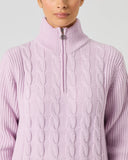 Daily Sports Pink Cable Pullover Liined close-up of soft lilac pink cable-knit pattern with quarter-zip ribbed stand collar and silver logo zipper pull detail