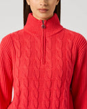 Daily Sports Poppy Red Cable Pullover Unlined close-up of bold poppy red cable-knit pattern with quarter-zip ribbed stand collar and silver logo zipper pull detai