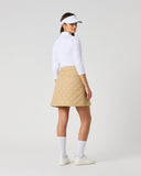 Women's camel quilted golf skirt with diamond quilted pattern and A-line silhouette – back view
