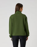 Women's khaki green relaxed fit mid-layer golf top with ribbed cuffs and Daily Sports logo tab – back view
