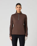 Women's brown long sleeve half zip golf top with white contrast stripe sleeves and stand-up collar – front view
