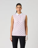 A woman modeling a short-sleeve collared polo shirt with a red and white gingham check pattern, paired with black pants and a white glove, against a light gray studio background.