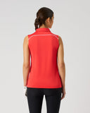 Daily Sports Poppy Red Piping Sleeveless Polo in bold poppy red – women's sleeveless golf polo showing white contrast piping along shoulder seams and clean back panel, back view on model styled with black trousers
