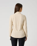 Women's cream textured wave pattern long sleeve golf top with fitted silhouette and stand-up collar – back view
