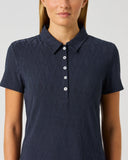 Daily Sports Dark Navy Graphic Jacquard Polo Shirt close-up of tonal navy jacquard fabric texture with classic polo collar and white contrast button placket detail