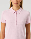 Daily Sports Pink Graphic Jacquard Polo Shirt close-up of blush pink tonal wave jacquard fabric with classic polo collar and white contrast button placket detail