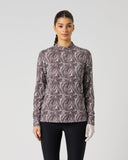 Daily Sports Dull Zebra Long Half Neck Shirt in muted mauve and cream abstract zebra swirl print – women's long sleeve golf base layer with mock neck collar and slim fit, front view on model