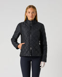 A woman modeling a black quilted zip-up jacket with a stand-up collar, paired with dark pants, against a plain light gray studio background.